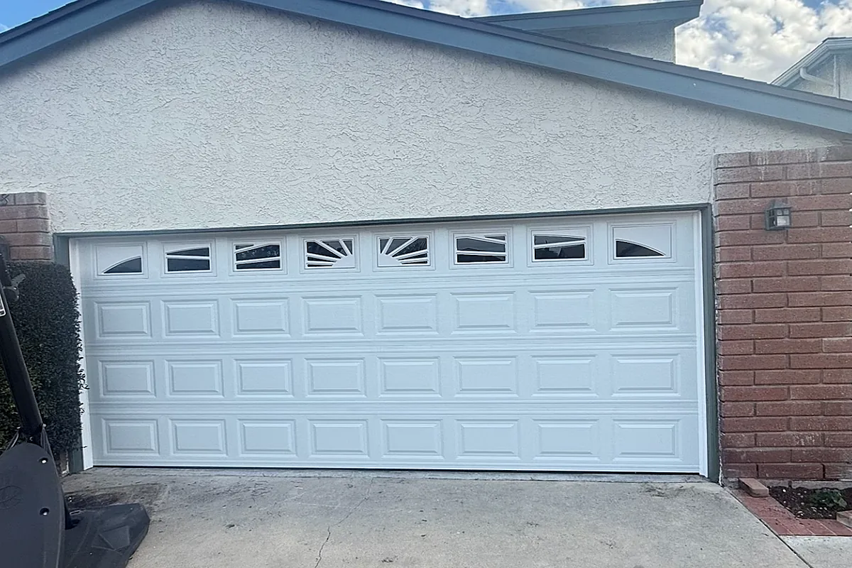 After: garage door panel repaired and restored