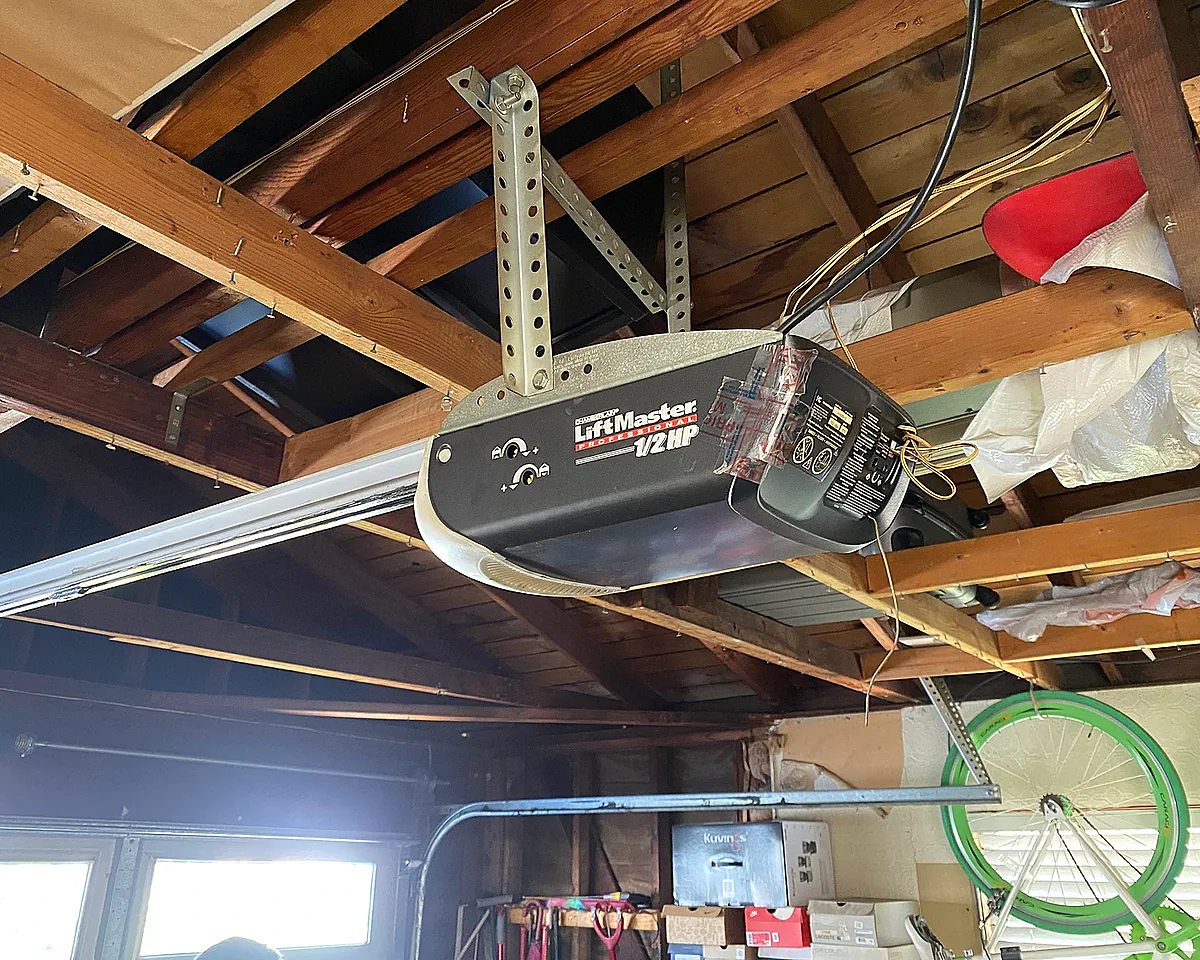 Before: old broken garage door opener motor