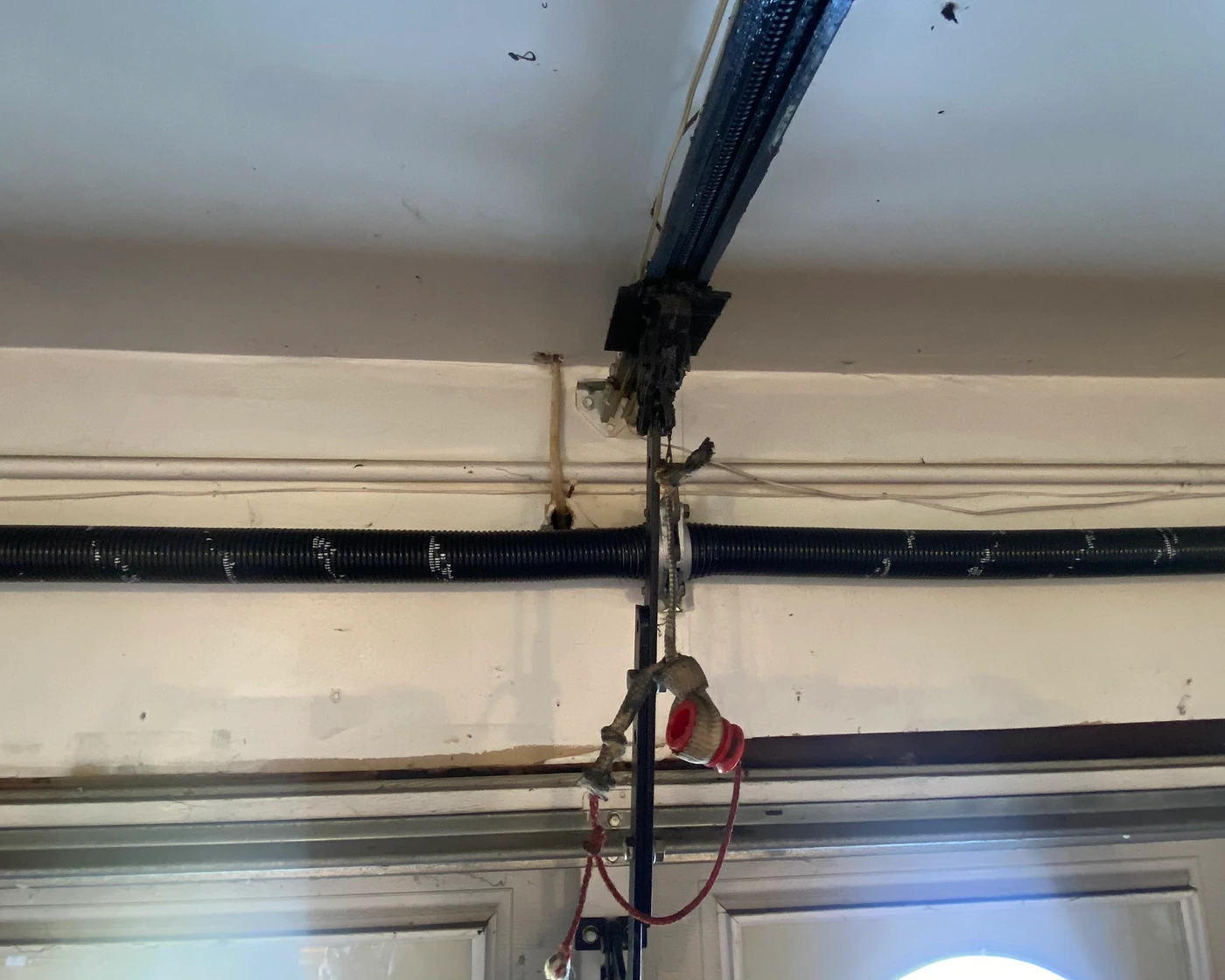 After repair: new torsion spring installed